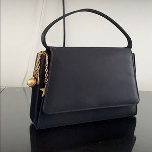 Black nicole Miller purse with golden Galaxy chain